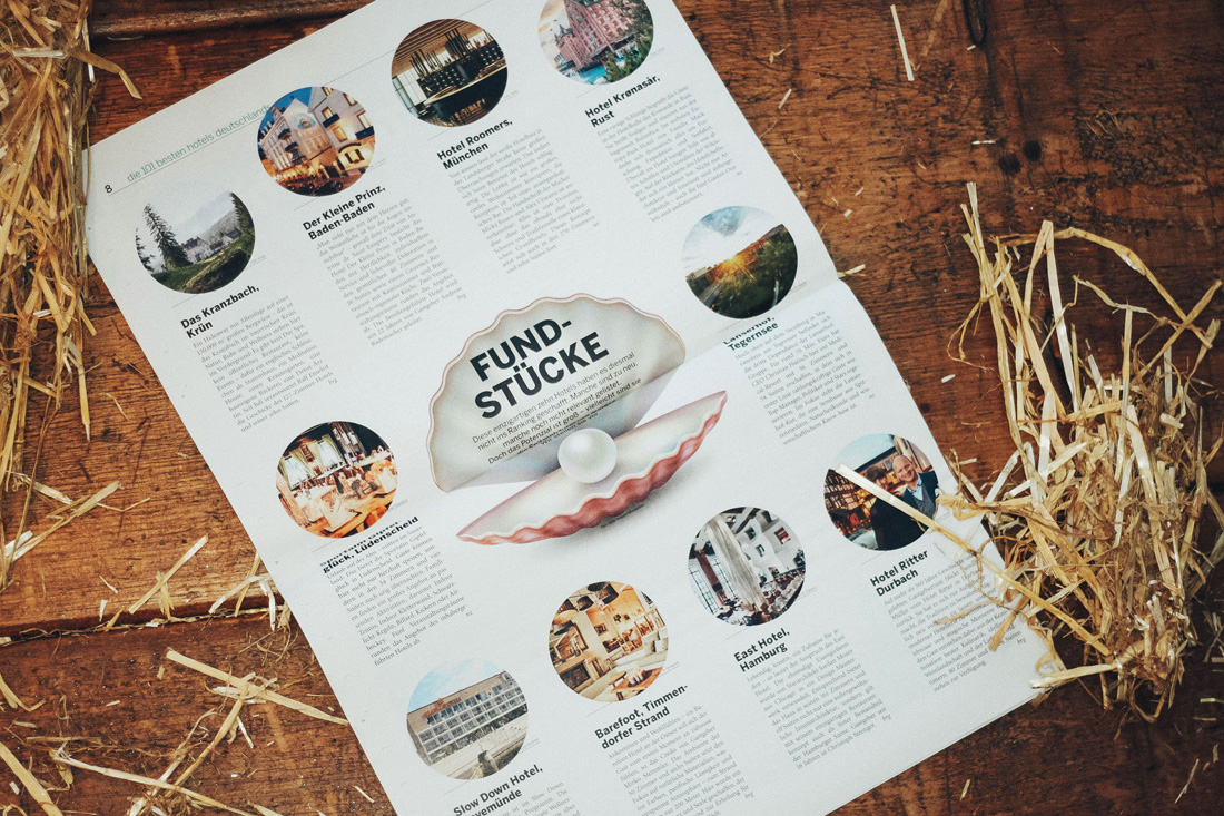 buch5 Aufgeschlagenes Buch, in welchem zehn Hotels als besondere "Fundstücke" vorgestellt werden, Hotel Sportalm Gipfelglück wird ebenfalls beschrieben